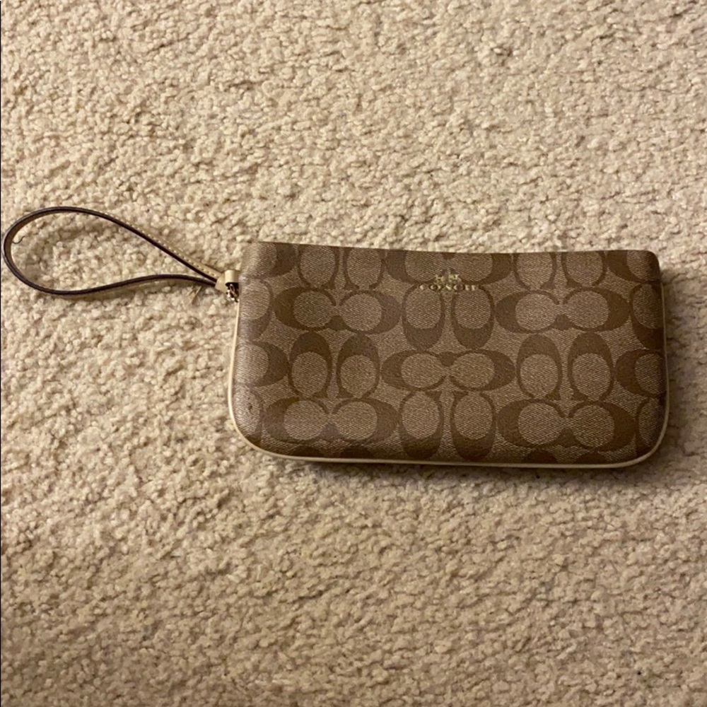 Coach wristlet, minor mark in picture